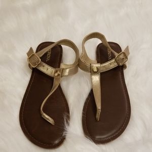 Gold T-strap sandals